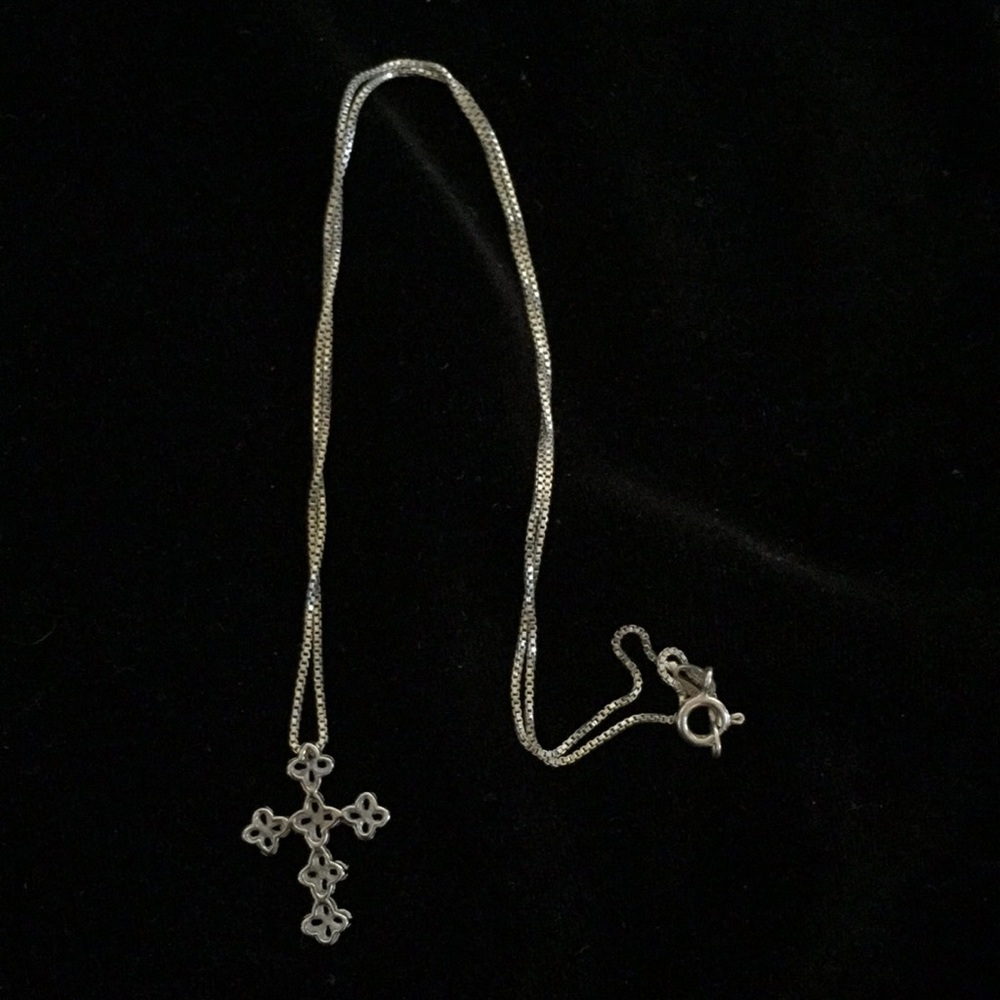 Sterling silver cross on 18” chain. Beautiful!